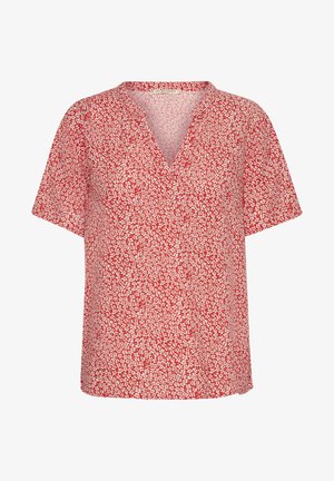 Rdeča kratko rokava bluzica z V-izrezom in cvetličnim vzorcem z belimi in svetlo roza akcenti na rdeči podlagi. Mehka tekstura tkanine.