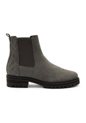 Botte Chelsea en daim gris avec panneau arrière matelassé, élastique latéral, languette de tirage et semelle à crampons pour une meilleure traction.