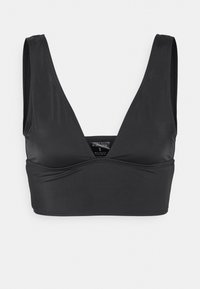 Sutiã atlético preto com design em V, alças largas e textura suave. Apresenta uma construção sem emendas para conforto e suporte.