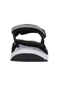 Svarta sandaler med justerbara remmar, ett mönstrat grått accent och en vit sula med texturerat grepp. Frontal vy som visar remdesign.