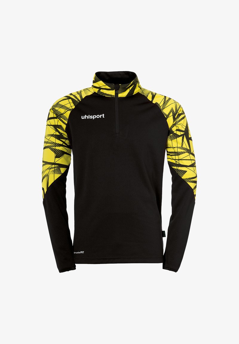 Zwarte lange mouw pullover met een halve rits kraag. Heeft een gele geometrische patroon op de schouders. Het materiaal lijkt glad en lichtgewicht te zijn.