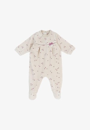 Body pour bébé couleur crème avec manches longues, jambes munies de pieds, des points roses éparpillés, un petit nœud violet et une fermeture à boutons devant au niveau du cou.