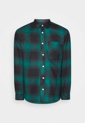 Mustakalt formaritiki ja teal ruudulise mustriga flanell särk, pika varrukaga, nööbiga sulgemine, rinnatasku ja sile tekstuur.