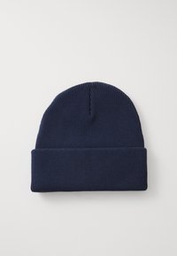 Knit beanie in navy blue, featuring a folded cuff, ribbed texture, and a soft, stretchy material for warmth and comfort.