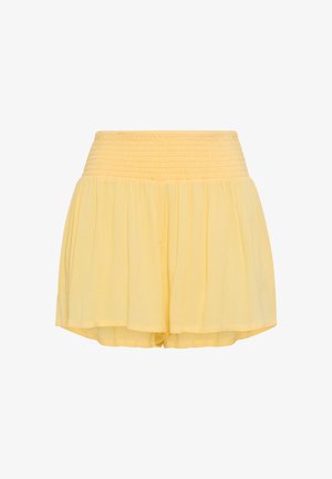 Yellow high-waist lightweight fabric shorts with smocked waistband and flowy, loose-fitting legs.