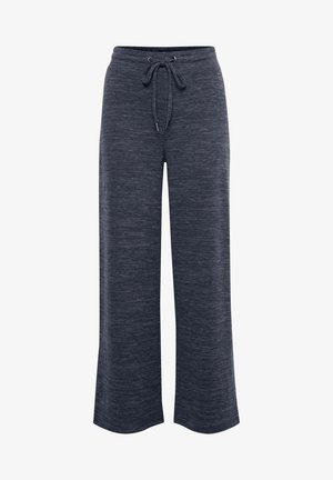 Tumedat hallid, laiad püksid, mis on valmistatud pehmest, tekstuuriga kangast ja millel on nööriga vöökoht. Selles on kogu ulatuses peen heatheri muster.