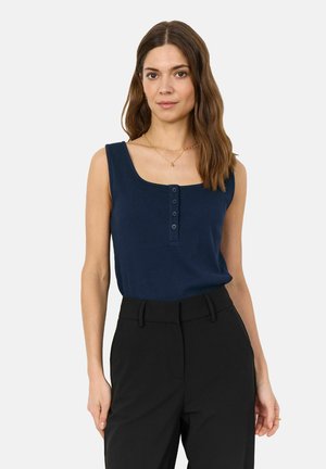 Navy ribbed tank top with square neckline and four button placket, paired with high-waisted black trousers, smooth fabric texture.