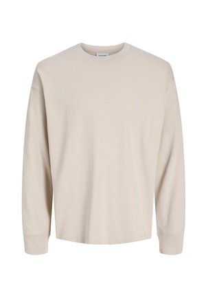 Koszulka z długim rękawem i okrągłym dekoltem w kolorze jasnobeżowym, wykonana z bawełny. Gładka faktura z prążkowanymi mankietami i luźnym krojem. Brak widocznych logo i wzorów.