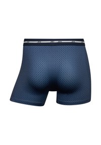 Navy blue boxer shorts with a textured, diamond pattern and a contrasting waistband featuring the brand name.