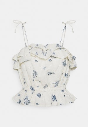 Witte mouwloze blouse met blauwe bloemenprint, geplooide halslijn en zoom, en verstelbare strikbandjes.