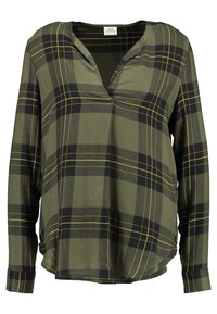 Grün karierte Bluse mit schwarzen und gelben Linien, langen Ärmeln, V-Ausschnitt und lockerer Passform, aus leichtem Stoff gefertigt.