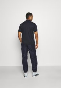 Sergio Tacchini CARSON - Calças de fato de treino - navy/red