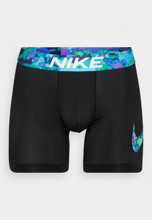 Čierne športové kraťasy s farebným vzorovaným pásom. Výrazné biele logo Nike na ľavej strane. Vyrobené z elastického materiálu.