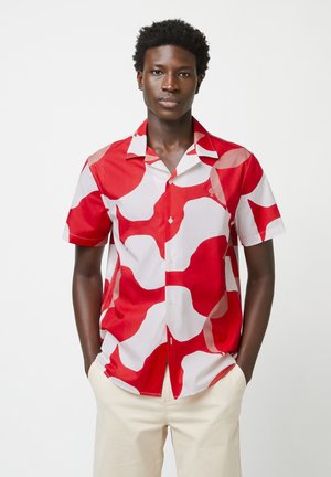 Short-sleeve shirt in red and white with abstract, wavy patterns; lightweight fabric; button-up design; standard collar; side pocket.