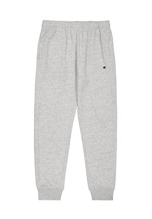 Sivé tepláky vyrobené z mäkkej látky, s elastickým pásom a manžetami, bočnými vreckami a malým logom na ľavom stehne.