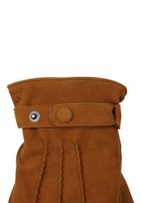 Brown suede glove with a fold-over cuff, featuring a snap button accent and vertical stitching details. Soft texture and structured shape.