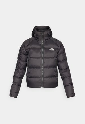 Black puffer jacket with a zip front and hood. Features quilted texture, elastic cuffs, and logo on the left chest. Lightweight insulation.