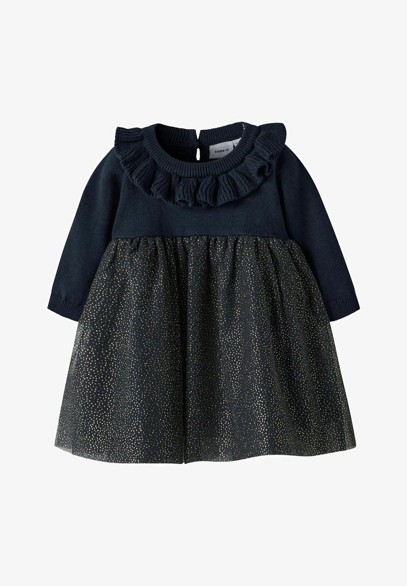 Tumes pikkade varrukatega kleit, millel on volangidega kaelus ja sädeleva kuldsete täppidega pitsseelik, tagant nööpide sulgemisega ja elastne korpus.