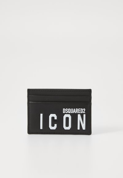 Black leather cardholder with four card slots, featuring raised white lettering "DSQUARED2" and "ICON" on the front. Smooth texture.