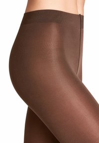 Collants bruns semi-transparents avec une texture lisse, dotés d'une large ceinture et d'un design sans coutures pour une apparence épurée.
