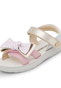 Sandalino per bambini rosa e oro con un fiocco decorativo, dotato di cinturini sintetici, soletta imbottita e chiusura in velcro.