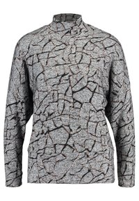Top gris de manga larga con un patrón texturizado de craquelado en negro y naranja, con cuello alto y corte relajado. Tejido de punto suave.