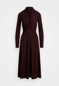 Burgundy långärmad klänning med en vriden frontdesign, åtsittande bål och flödande kjol. Tillverkad av ett mjukt, elastiskt tyg.