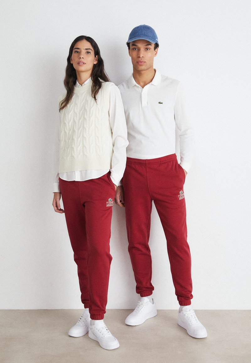 Lacoste SUBTLE LOGO TRACKPANT UNISEX - Treningo apatinė dalis - ora