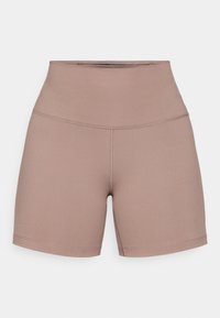 Pantaloni sportivi mauve a vita alta con cuciture piatte e un tessuto elasticizzato morbido, progettati per l'abbigliamento attivo.
