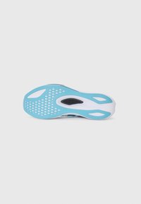 Shoe sole with a blue rubber design, featuring perforations for traction, smooth white accents, and a rounded shape for ergonomic support.