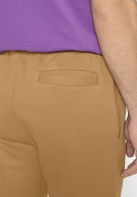 Lacoste Pantalon de survêtement - cookie