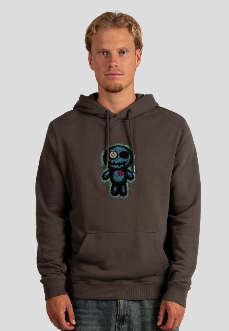 Felpa grigia in cotone con tasca frontale, caratterizzata da una grafica colorata di un personaggio dei cartoni animati sul petto. Corda con punte in metallo.