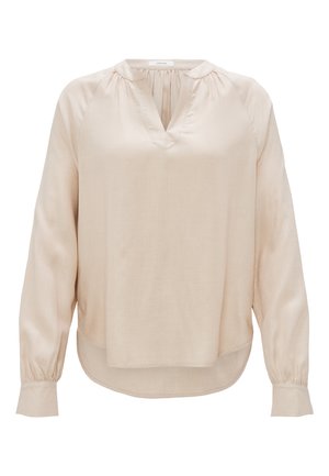 Beige Bluse mit langen Ärmeln, V-Ausschnitt und gefalteten Details. Aus glattem Stoff, mit gerüschten Schultern und abgerundetem Saum.