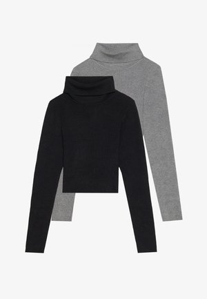 Kaksi korkeakauluksista puseroa: yksi musta, yksi harmaa, molemmissa on ribbitekstuuri ja pitkät hihat, sievä malli ja taitettu kaulus.