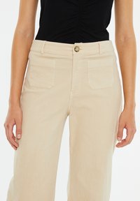 System Action Trousers - crudo