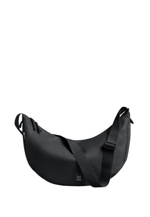 Borsa a tracolla nera a forma di mezzaluna con tracolla regolabile, chiusura con cerniera e piccolo logo "GOT BAG" al centro frontale.