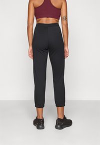 Champion C-TECH CUFFED PANTS INTERLOCK - Joggebukse - black