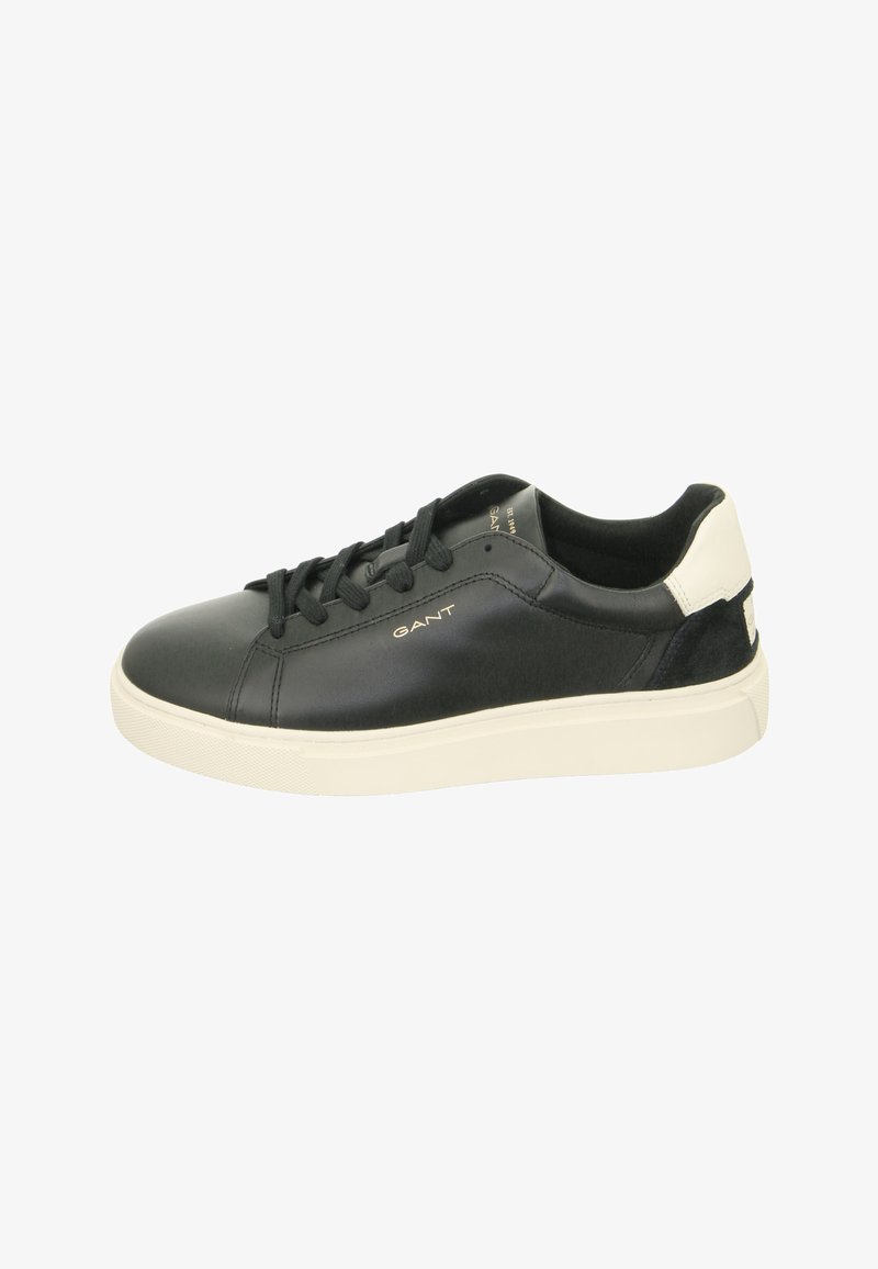 Black leather sneaker with round toe, lace-up design, white rubber sole, suede accent at the heel, and gold logo detailing on the side.