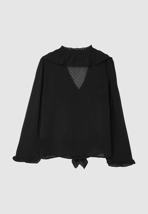 Blusa nera a maniche lunghe con colletto arricciato, texture a pois, scollo a V sul retro e dettaglio con laccio sull'orlo. Tessuto trasparente e vestibilità ampia.