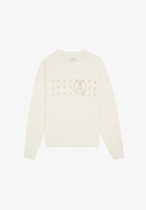 Kremowa bluza z okrągłym dekoltem, długimi rękawami, ściągaczami na mankietach oraz graficznym nadrukiem z tekstem i czaszką w okręgu.