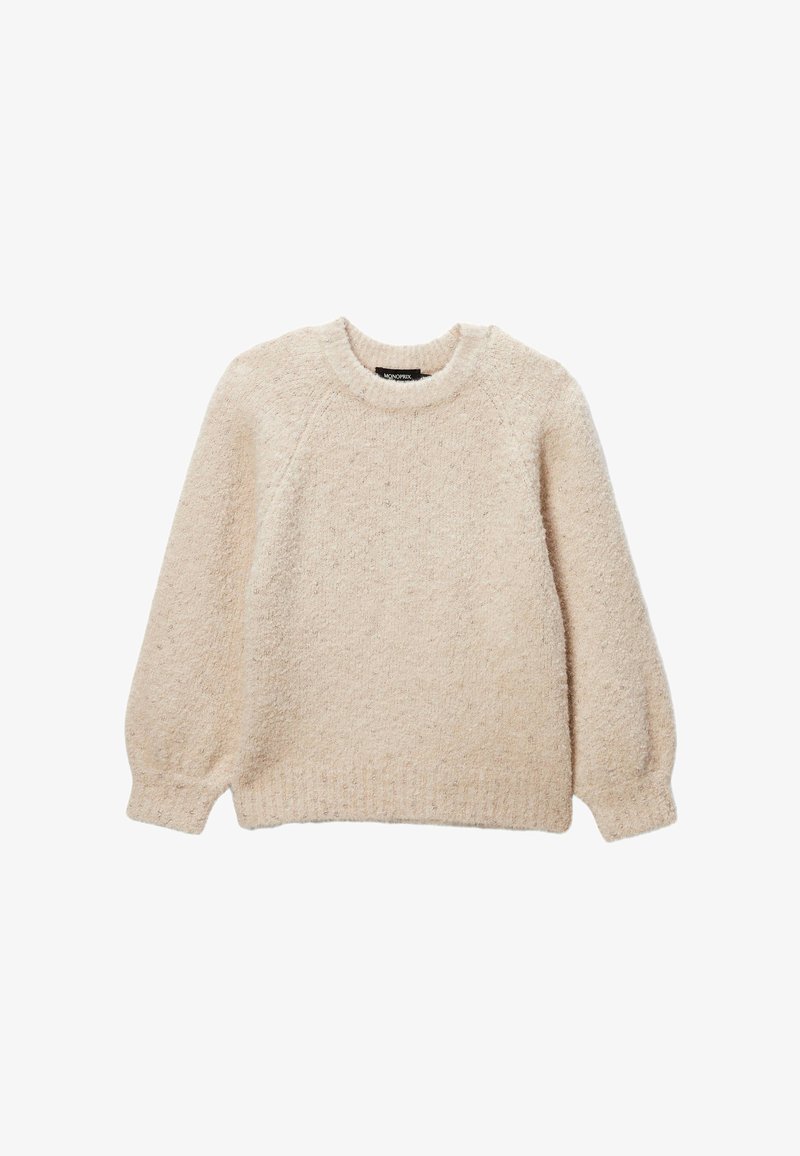 Pull en tricot beige avec une surface texturée et duveteuse, encolure ronde et manches raglan. Taille et poignets côtelés. Coupe décontractée.