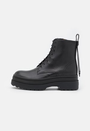 COMBAT BOOTIE - Kotníkové boty na platformě - nero