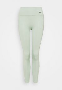 Leggings atletici verde chiaro realizzati in materiale elasticizzato, con un alto punto vita, tasche laterali e un piccolo logo nero vicino alla vita.