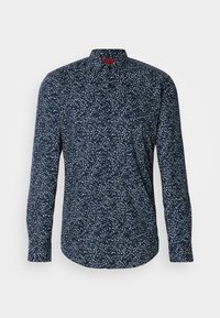 Navy long-sleeve shirt with a white floral pattern, button-down collar, and curved hem. Made of a lightweight fabric with a smooth texture.