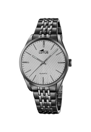 Silver Lotus quartz wristwatch with patterned white dial, silver hour markers, and linked metal bracelet strap.