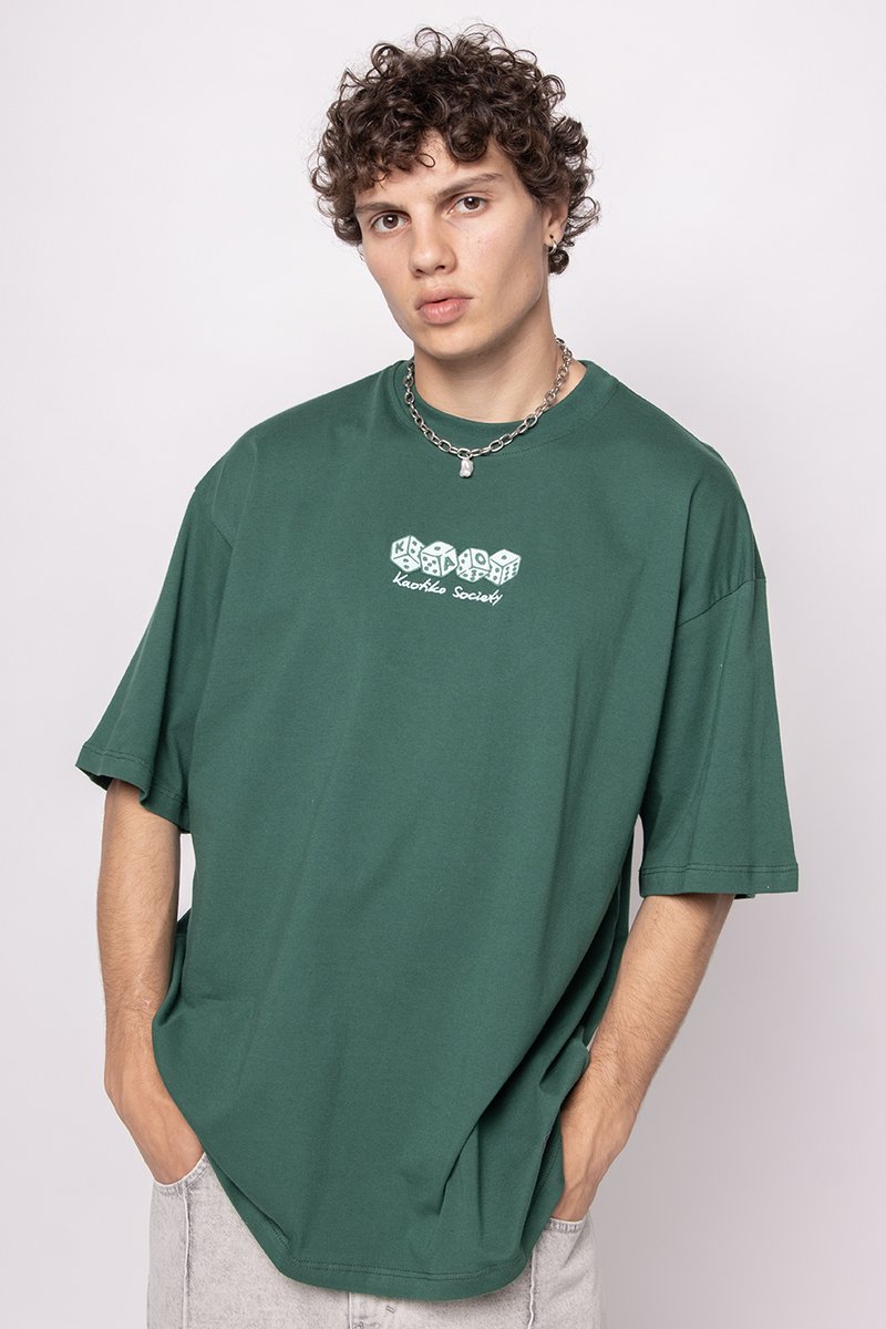 Green oversized t-shirt in cotton, featuring a round neckline and short sleeves. Includes a white graphic print with colored dice.