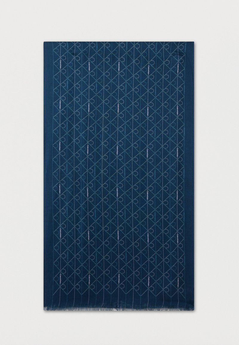 Μπλε ναυτικό ορθογώνιο κασκόλ με φωτεινά μπλε γεωμετρικά γραμμικά σχέδια και διακριτικό κάθετο κείμενο λογότυπου σε όλο το μήκος, με κρόσσια στις άκρες.