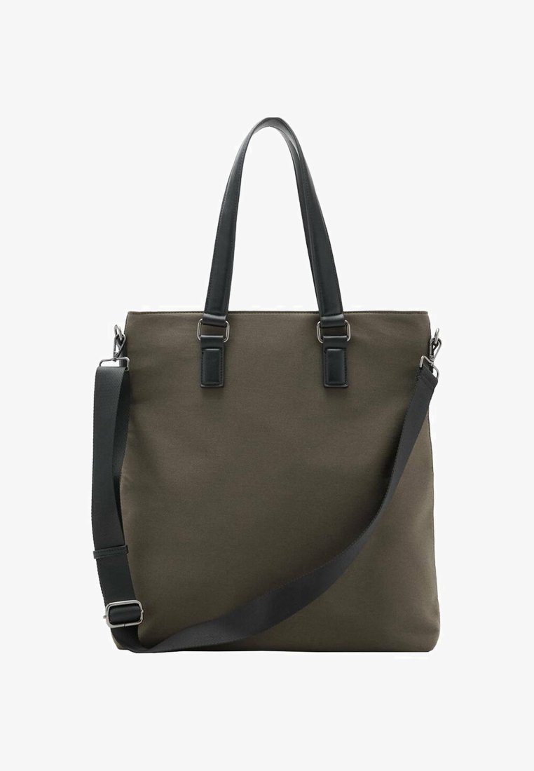 Sac fourre-tout en toile verte avec des accents en cuir noir, deux poignées supérieures et une bandoulière réglable. Design minimaliste avec des lignes épurées.
