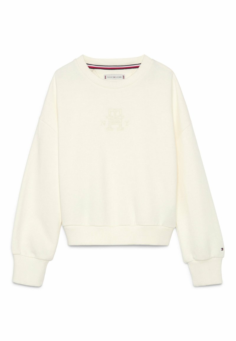 Sweat-shirt à manches longues couleur blanc cassé avec col rond, poignets et ourlet côtelés, logo brodé discret sur la poitrine, et petit logo sur le bracelet de la manche gauche.