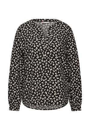 Blusa negra con patrón abstracto blanco, escote en V, mangas largas con puños fruncidos y corte holgado. Tejido liviano con una textura suave.
